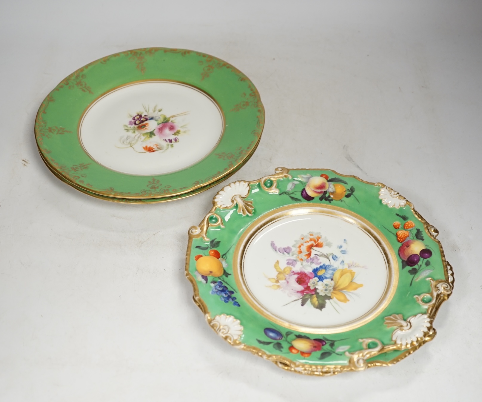 A group of English porcelain green ground dessert plates and dishes, largest 24cm diameter. Condition - fair